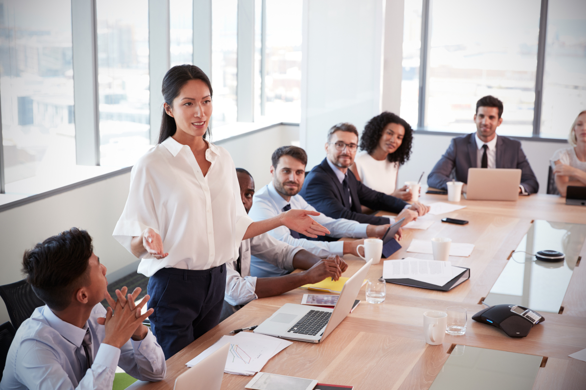 women presenting to coworkers