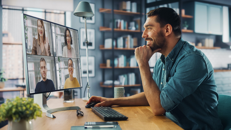 A manager demonstrates how to build a strong culture with a remote team by holding a regular team meeting on videoconference.
