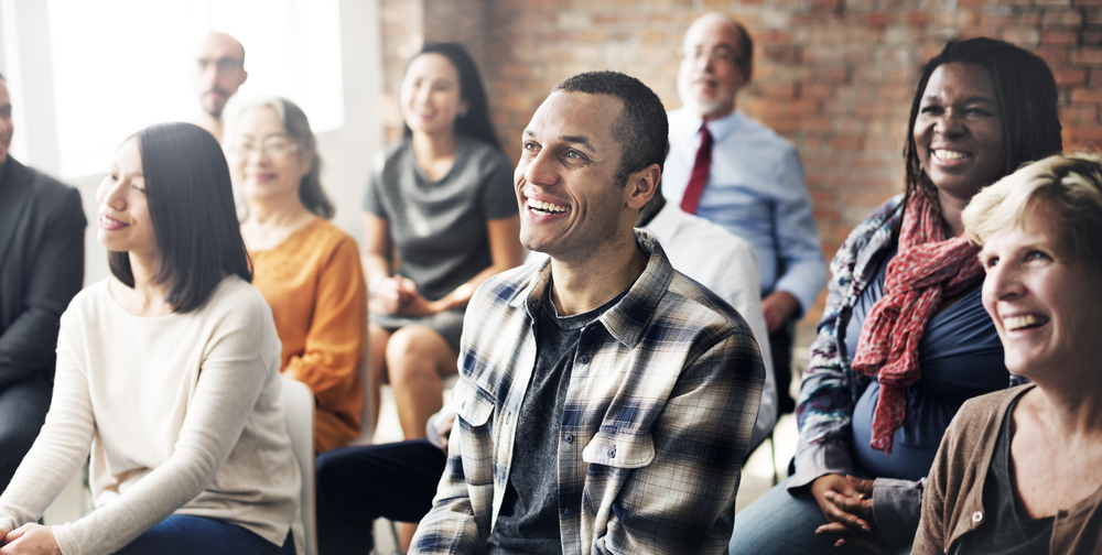 Happy colleagues in group meeting