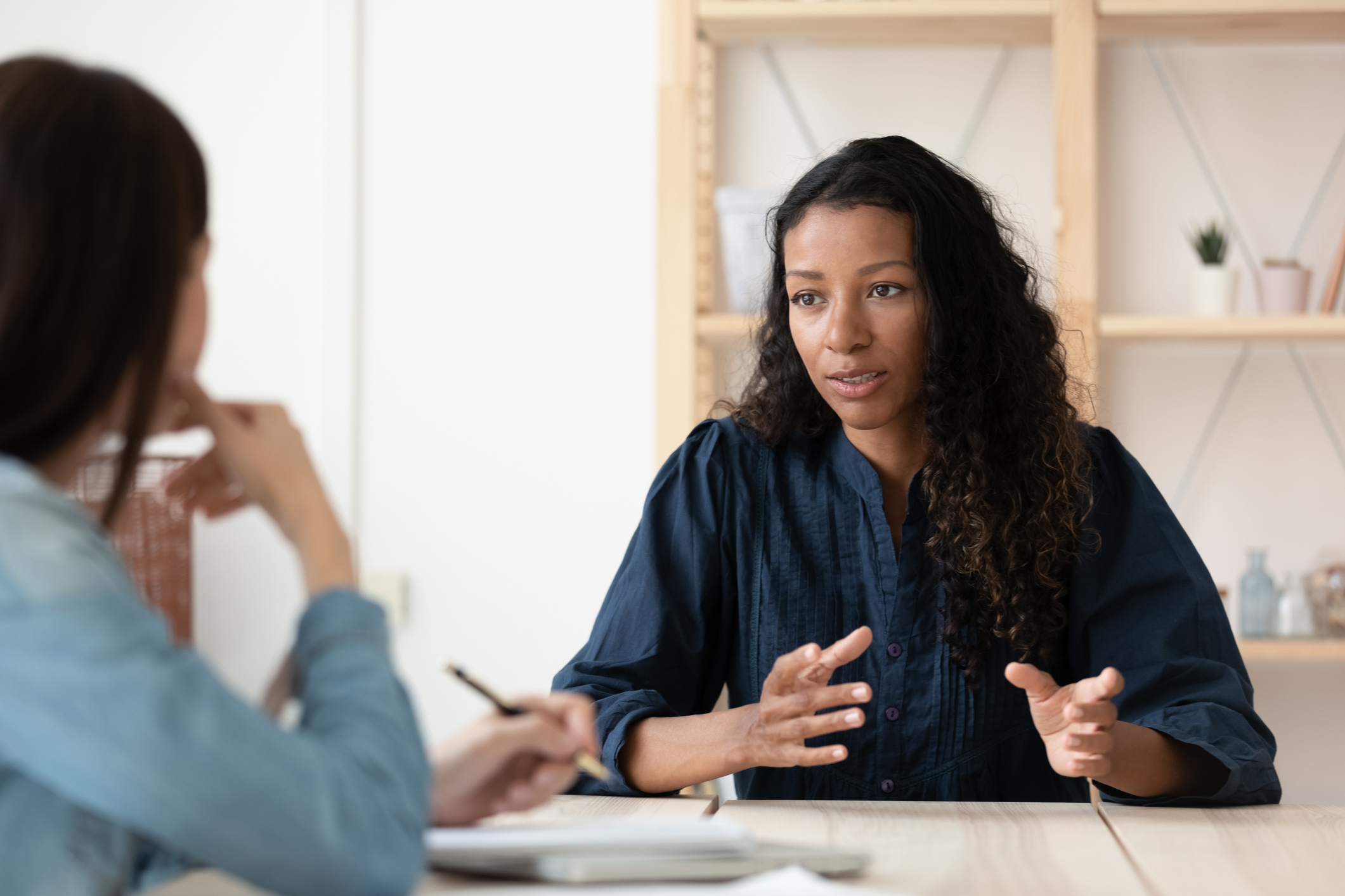 Confident African American woman candidate speaking at job interview