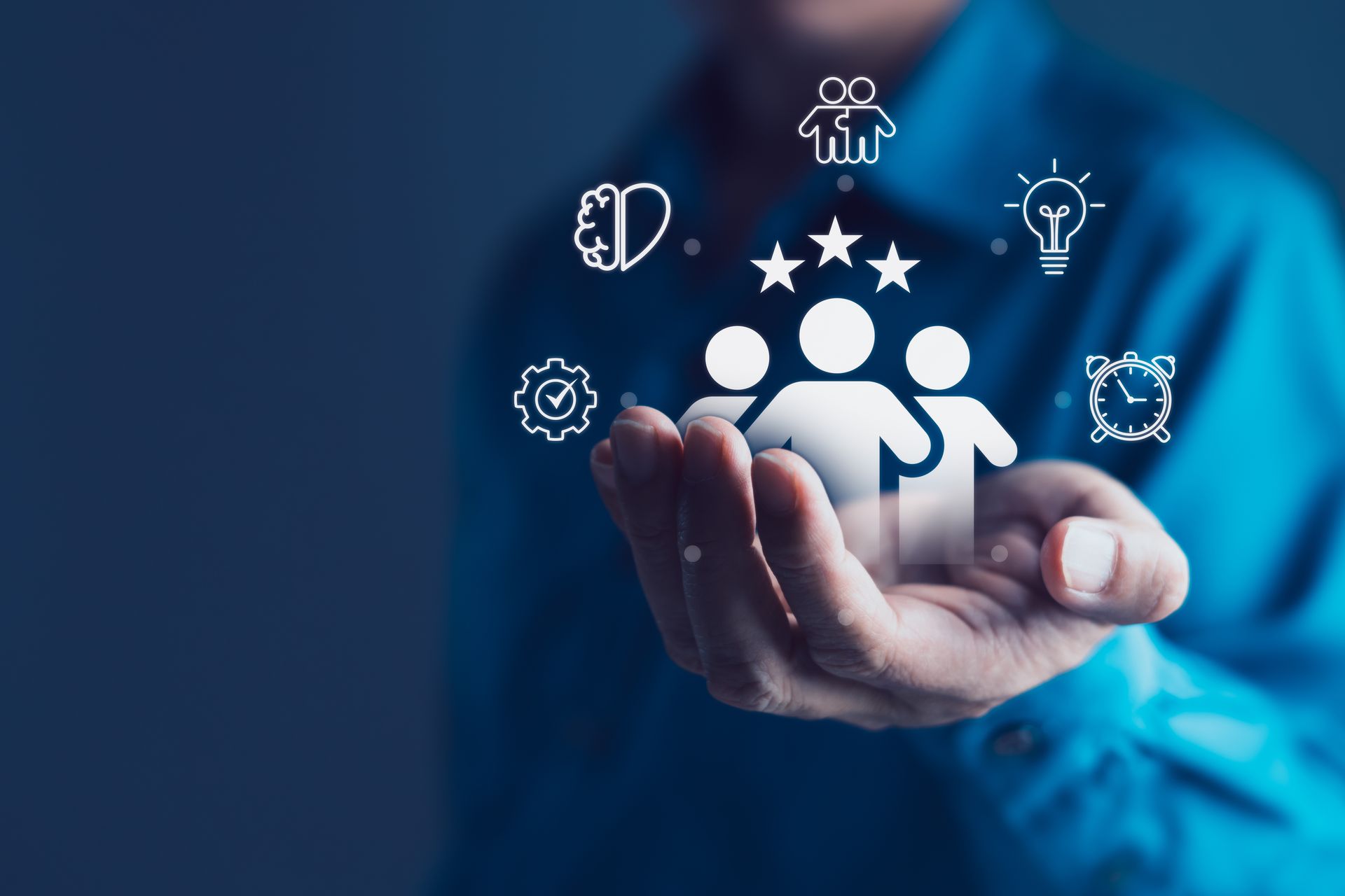 Retaining top talent: a leader holding team and growth icons in an open hand