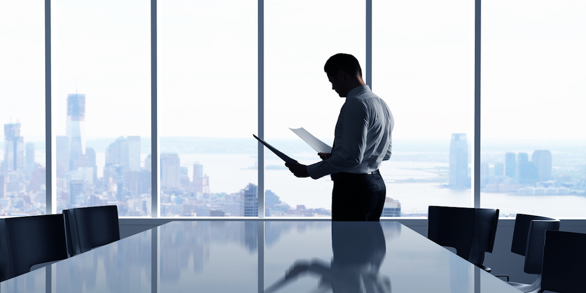 A young Black woman leads her team in a project meeting