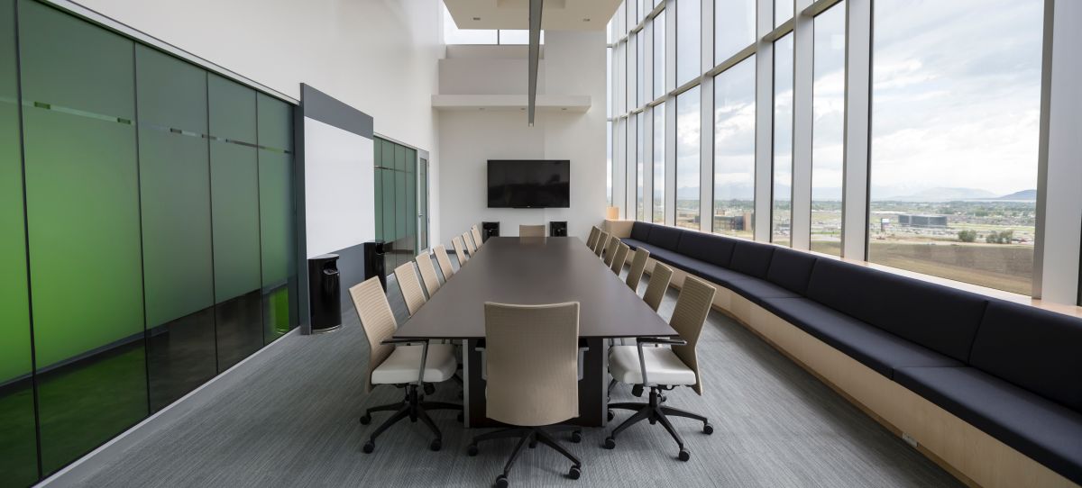 A young Black woman leads her team in a project meeting