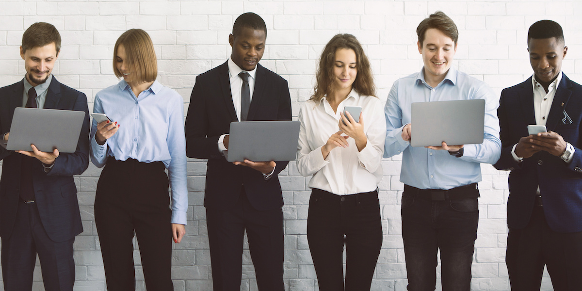 A young Black woman leads her team in a project meeting