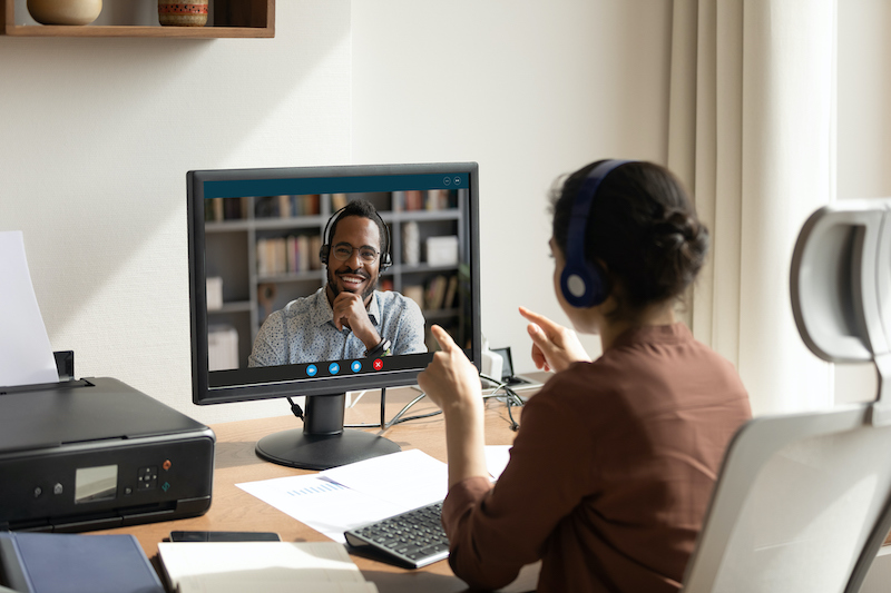 A young Black woman leads her team in a project meeting