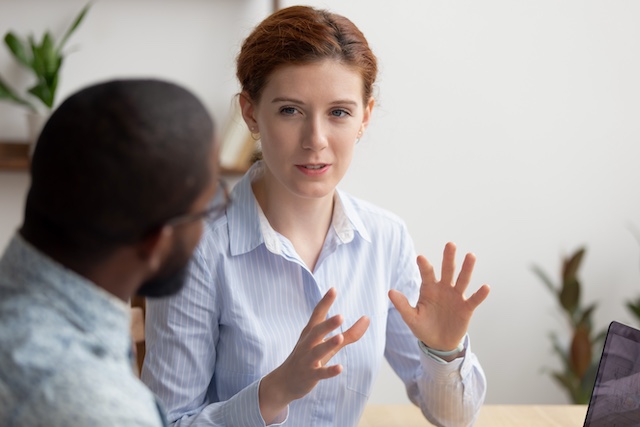 A female career coach works with a male manager