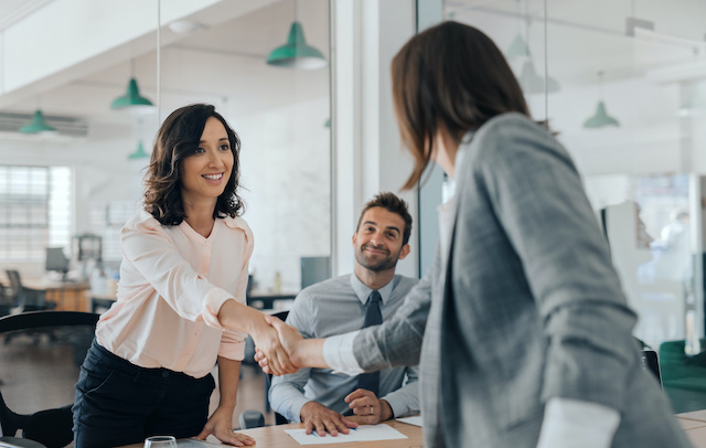 A female employee gets a promotion as a result of upskilling.