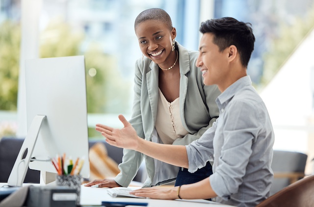 Black female manager supports her Asian male employee with career development