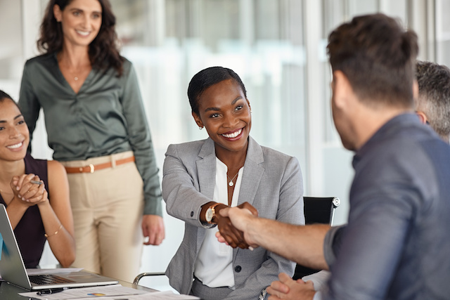 A Black female executive is welcomed in her new role in leadership