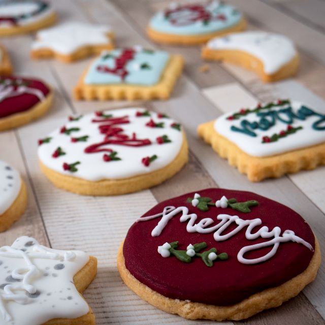 An assortment of iced, decorated holiday cookies