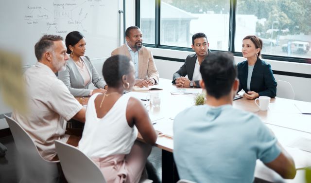 Department leaders meet to discuss talent development.