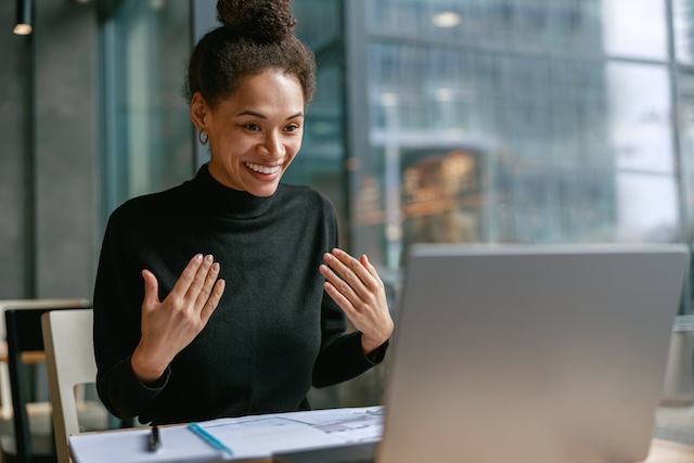 A woman offers career coaching guidance to a job seeker remotely.