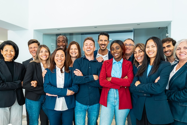 A young Black woman leads her team in a project meeting