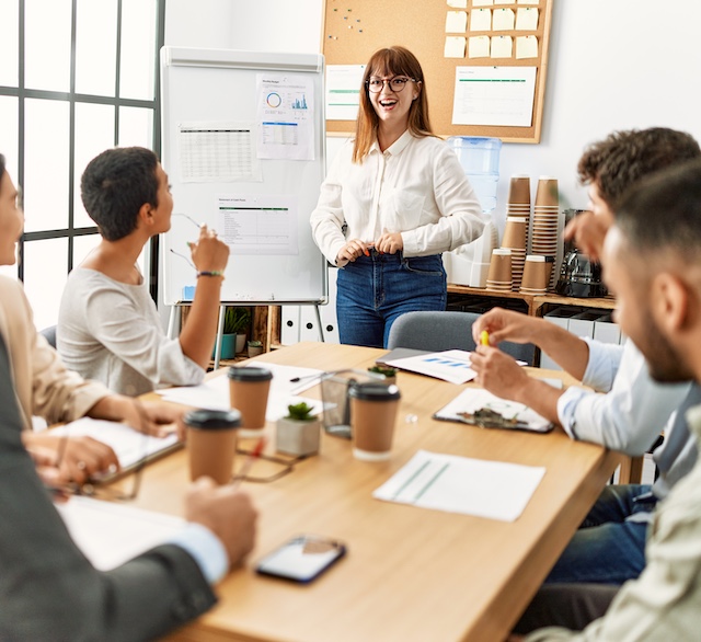 employee-training-2 Young woman leads a meeting of diverse colleagues