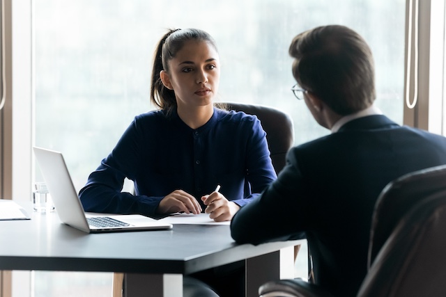 A young woman employee meets with her manager