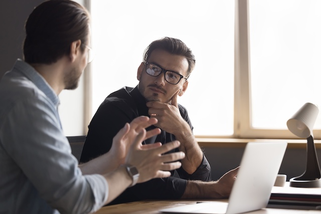 A man meets with his male employee